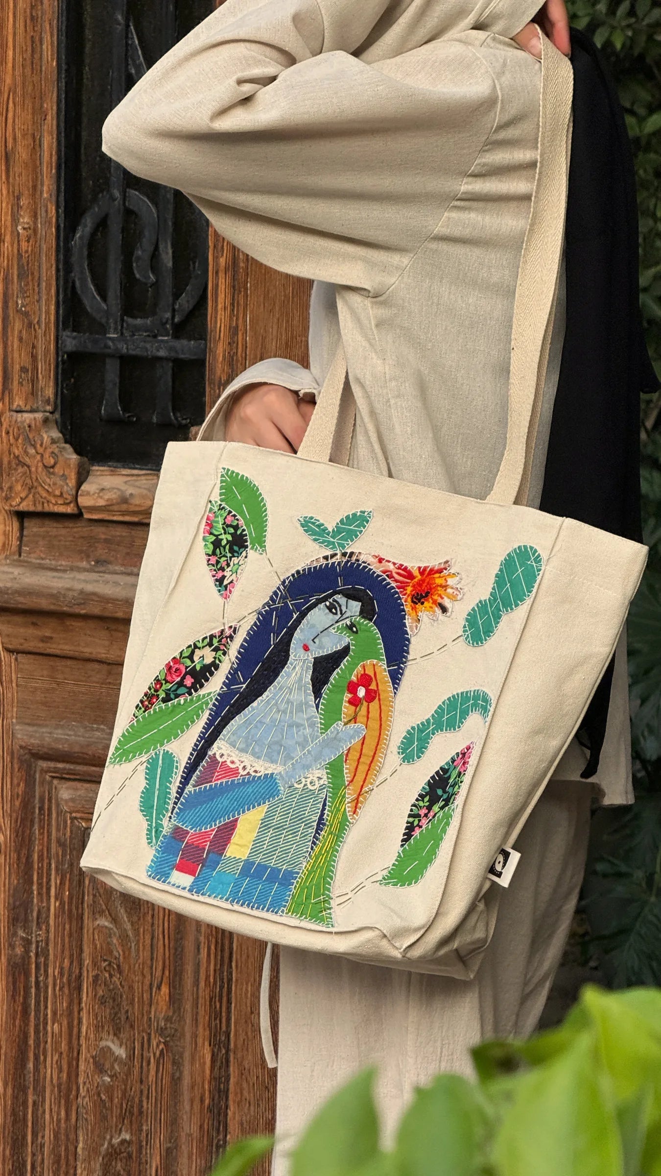 One-of-a-kind embroidered peacock tote