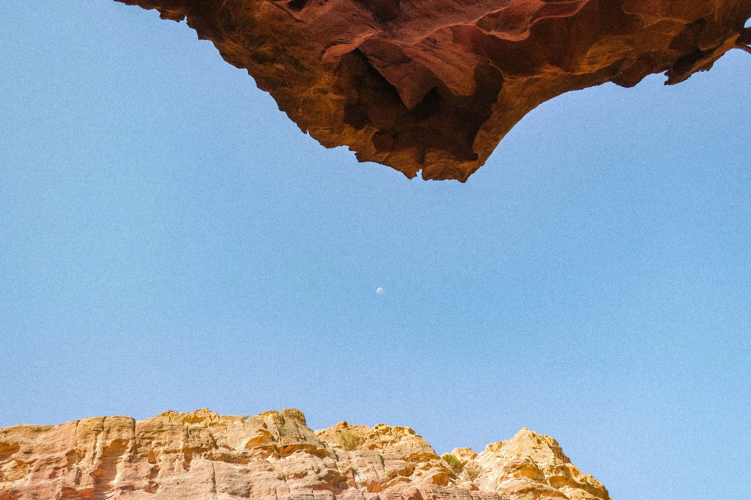 Open sky framed by warm rock formations